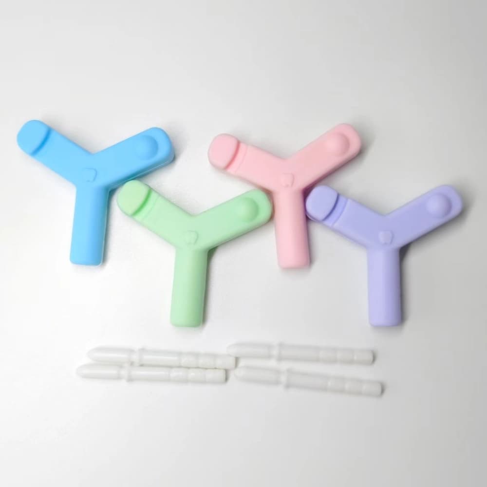 Blue, pink, green and purple Y-shaped aligner chewies with PP extension rods
