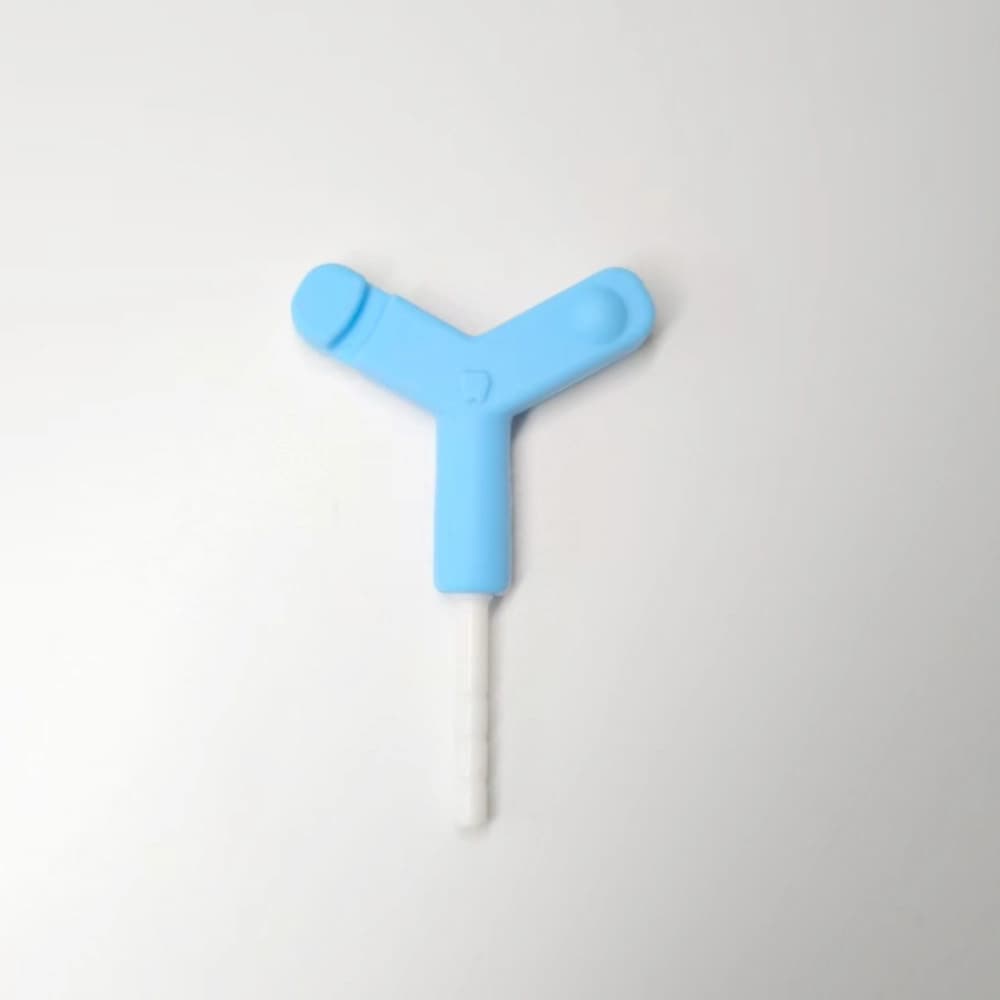Blue Y-shaped silicone aligner chewie with a white PP extension rod