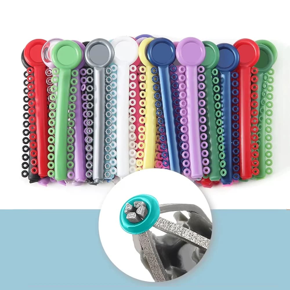 Elastomeric ligature tie strips with 26 round ties per strip and bracket detail