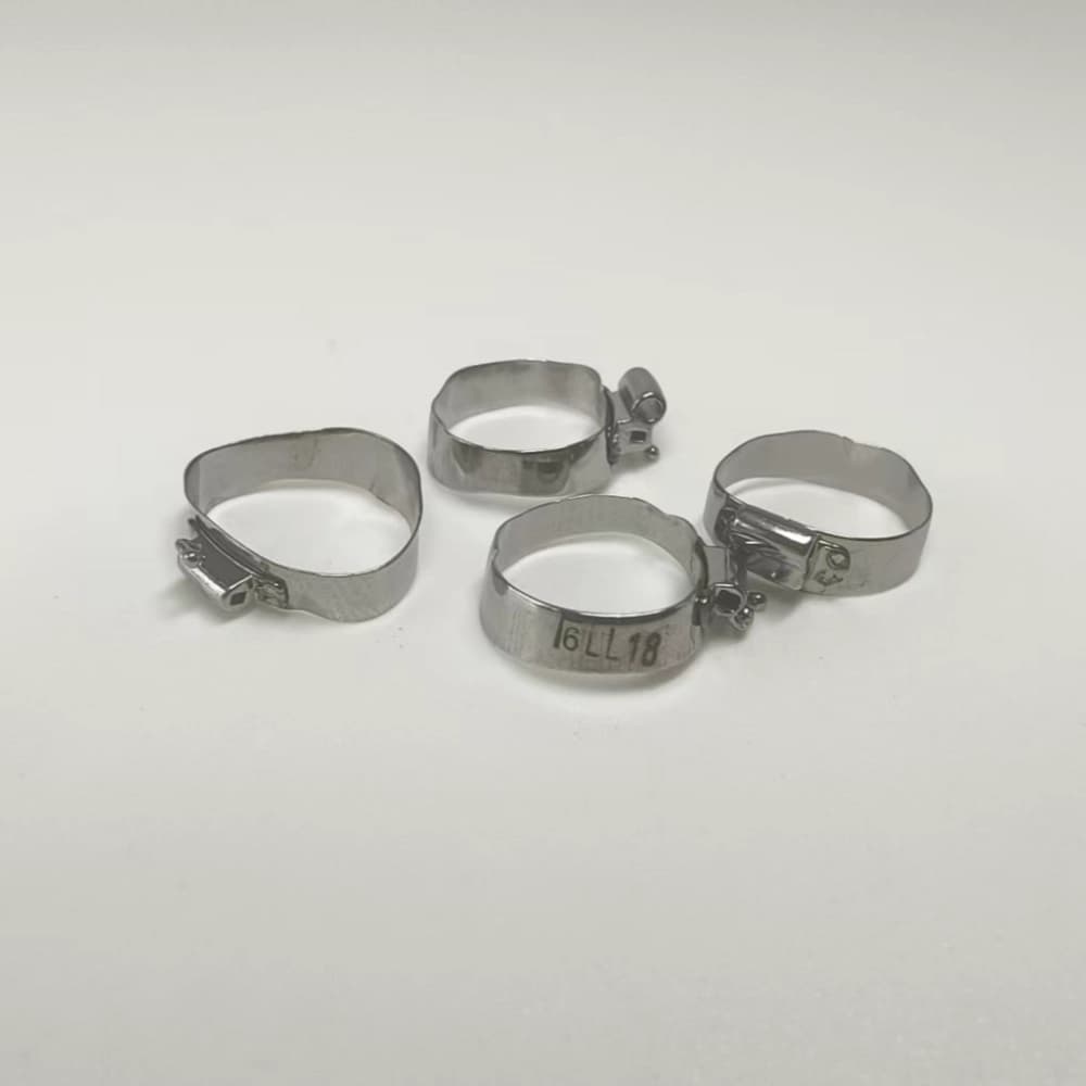 Four prewelded first molar bands with hooked upper and lower buccal tubes