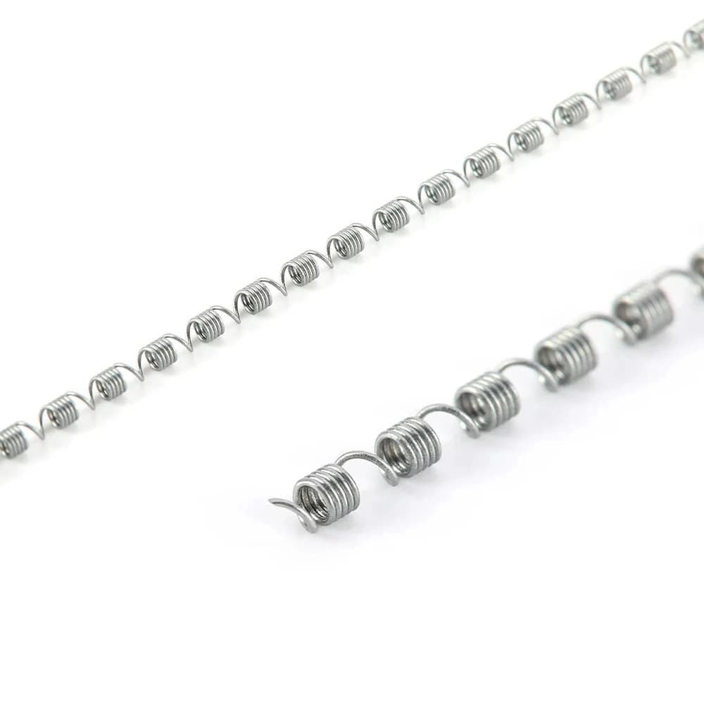 Close view of the alternating open and closed coil sections on a NiTi distalizing spring