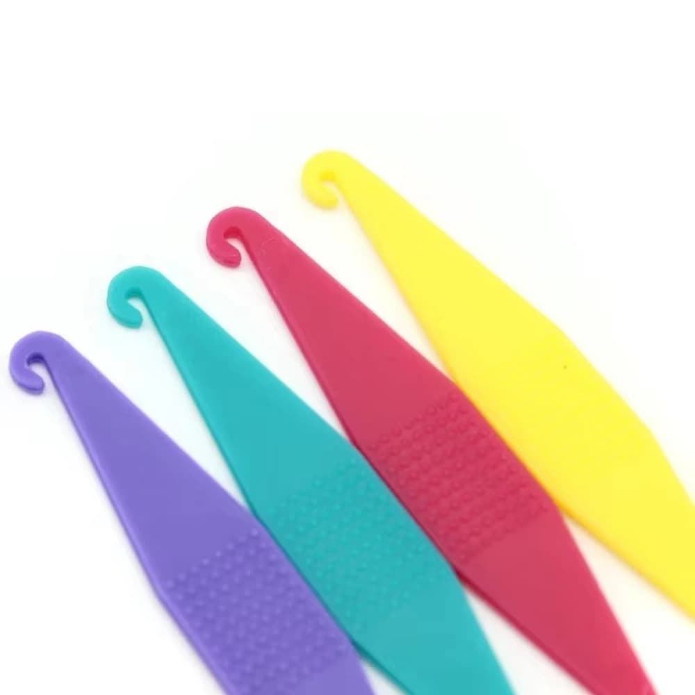 Hook ends of mixed-color orthodontic elastic placers for installing braces elastics