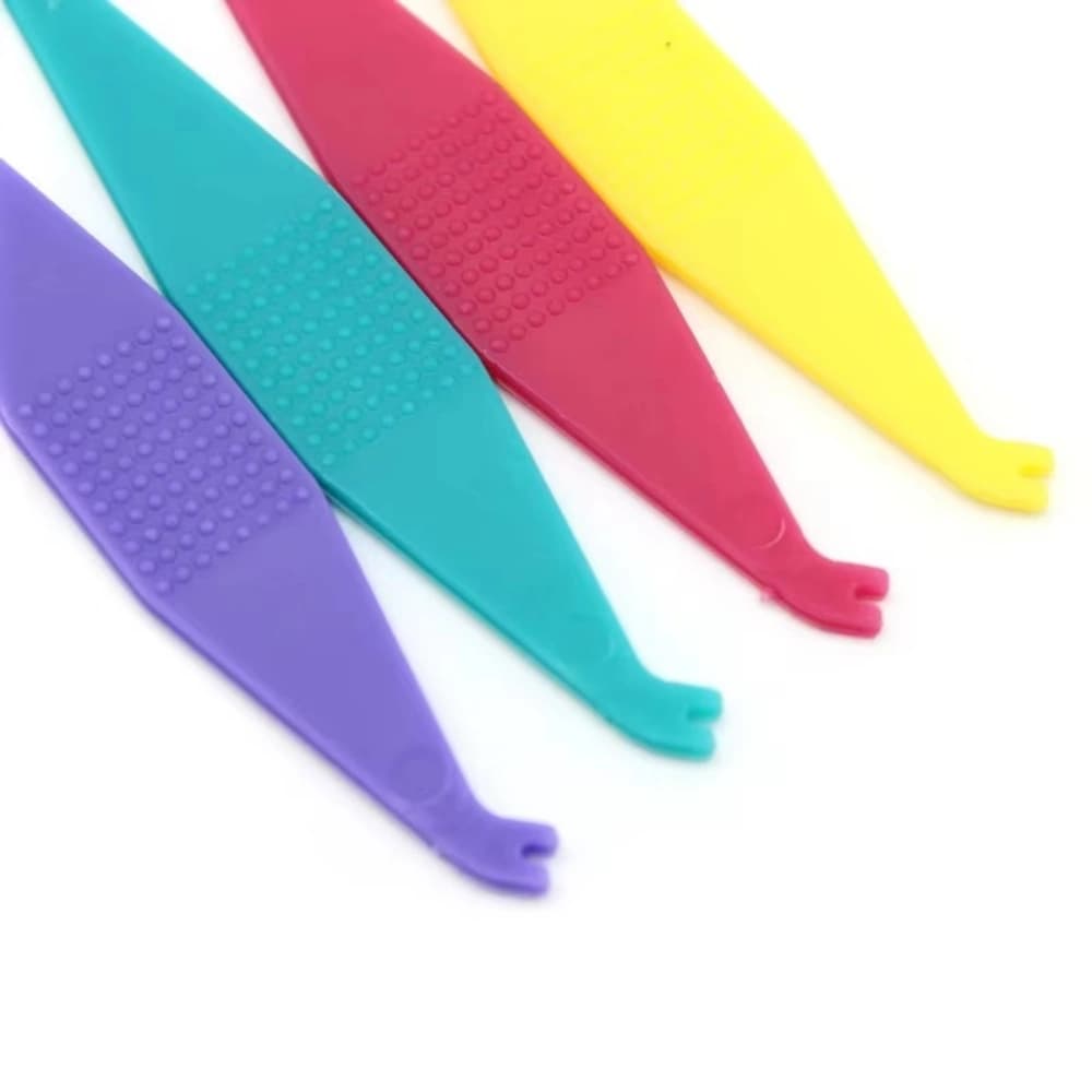 Forked removal ends of mixed-color orthodontic elastic placers