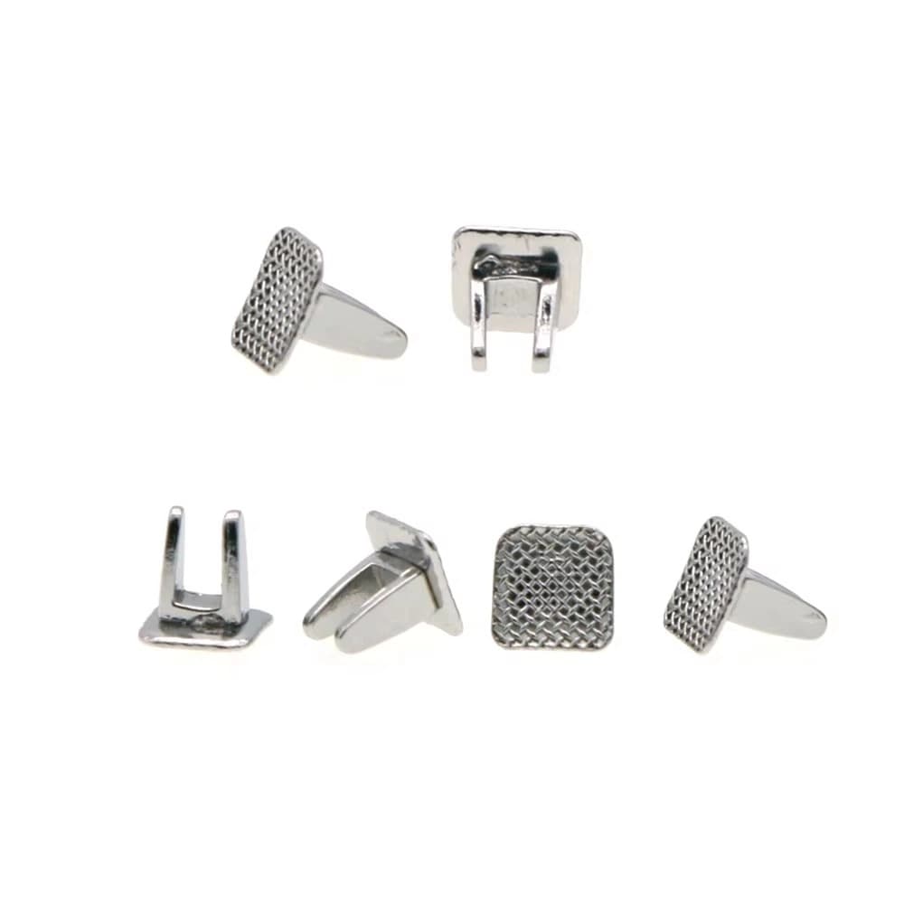 Bondable orthodontic tongue spurs with rectangular mesh bases