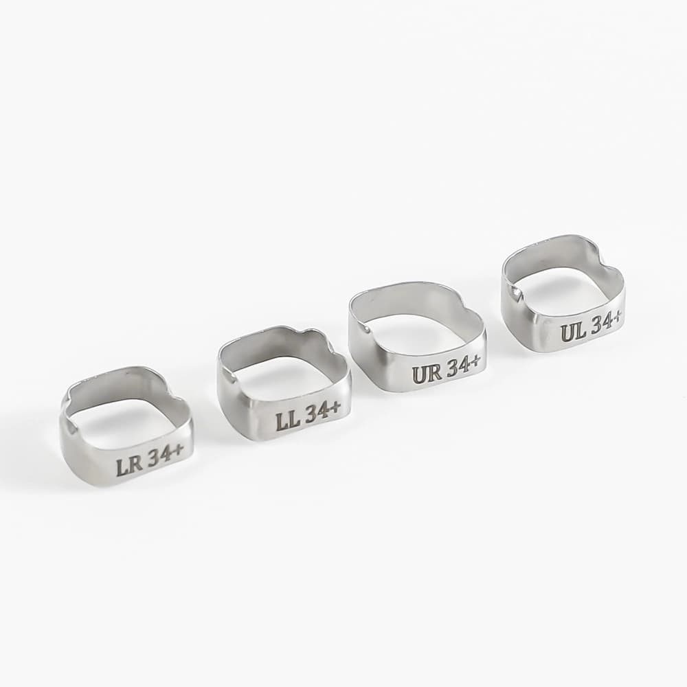 Four plain molar bands marked LR, LL, UR and UL in size 34 plus