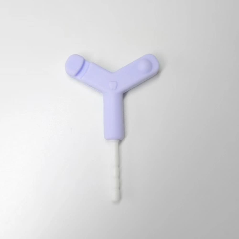 Purple Y-shaped silicone aligner chewie with a white PP extension rod