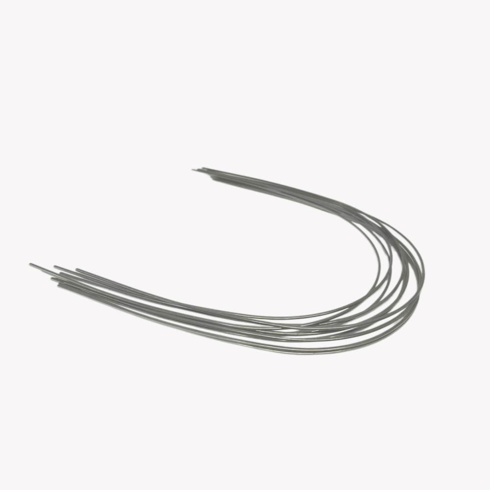 Group of polished stainless steel orthodontic archwires on a neutral background